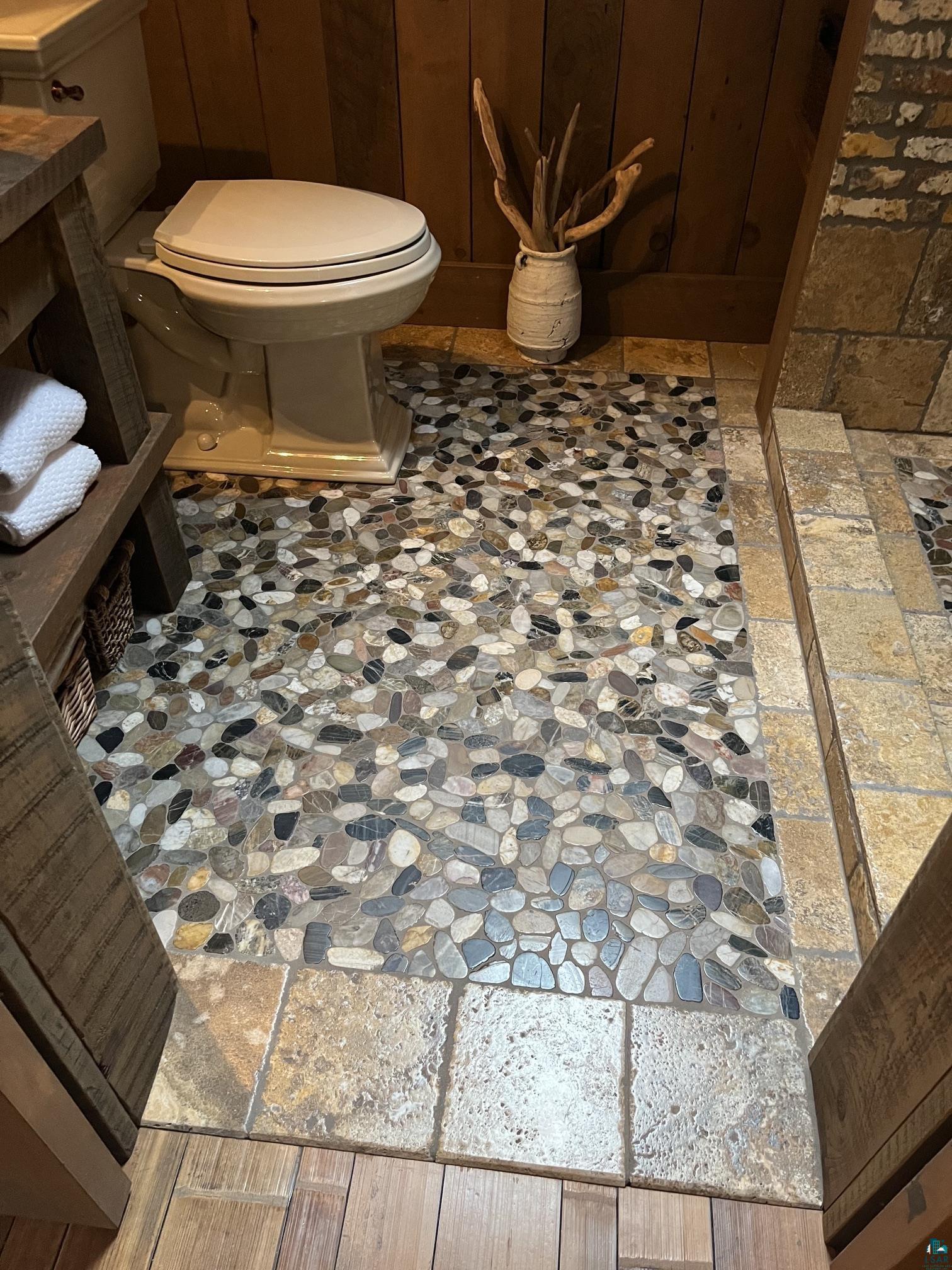 70745 Range Line Road Iron River, WI 54847 - Photo 37 of 40 Pebble tile flooring with natural stone tile accents
