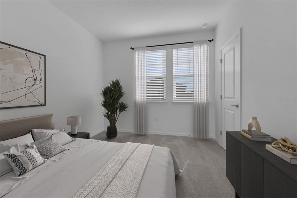 1812 Shadow Box Bend St. Cloud, FL 34771 - Photo 12 of 33 a bedroom with a bed and a window