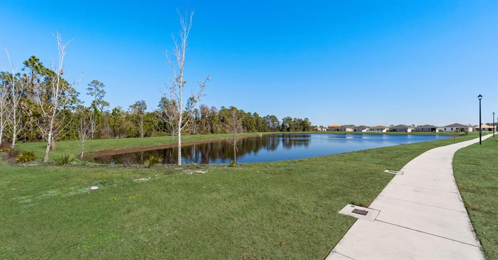 1812 Shadow Box Bend St. Cloud, FL 34771 - Photo 30 of 33 a view of a lake with houses