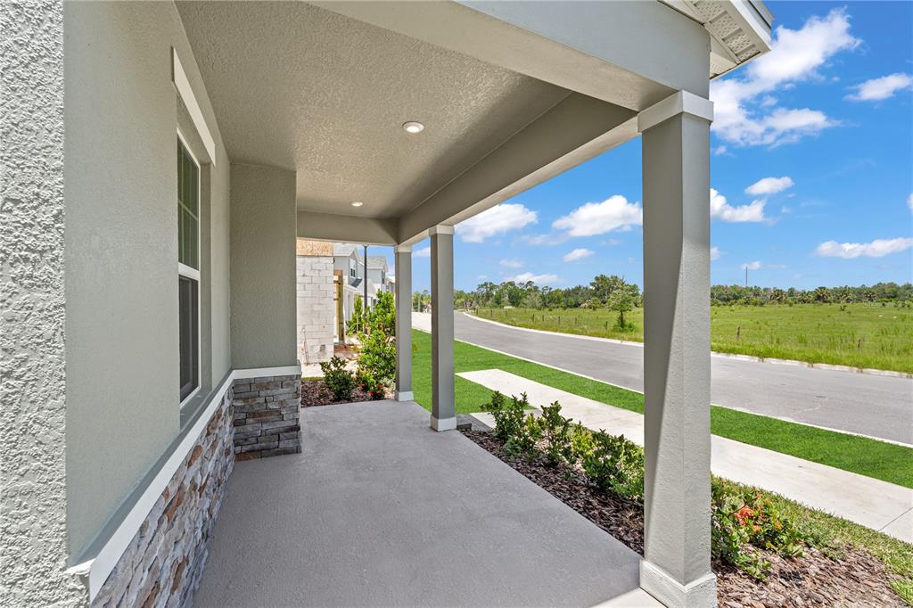 1812 Shadow Box Bend St. Cloud, FL 34771 - Photo 4 of 33 a view of a floor to ceiling window with a yard