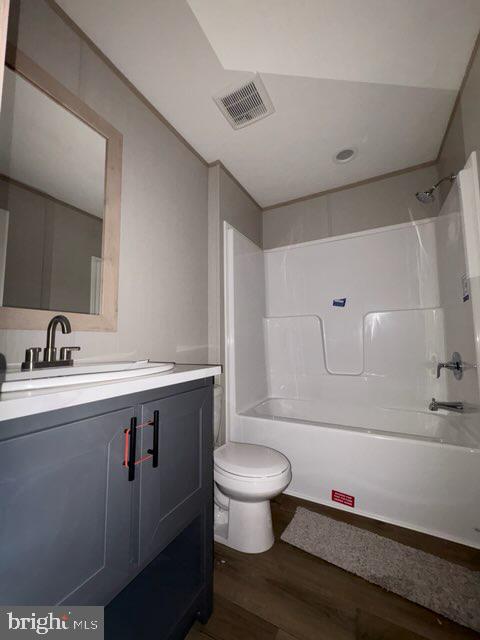 443 Fern Road Millville, NJ 08332 - Photo 18 of 24 a bathroom with a granite countertop sink mirror vanity and toilet