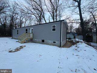 443 Fern Road Millville, NJ 08332 - Photo 2 of 24 a backyard of a house with a large tree