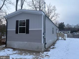 443 Fern Road Millville, NJ 08332 - Photo 7 of 24 a side view of a house with a yard