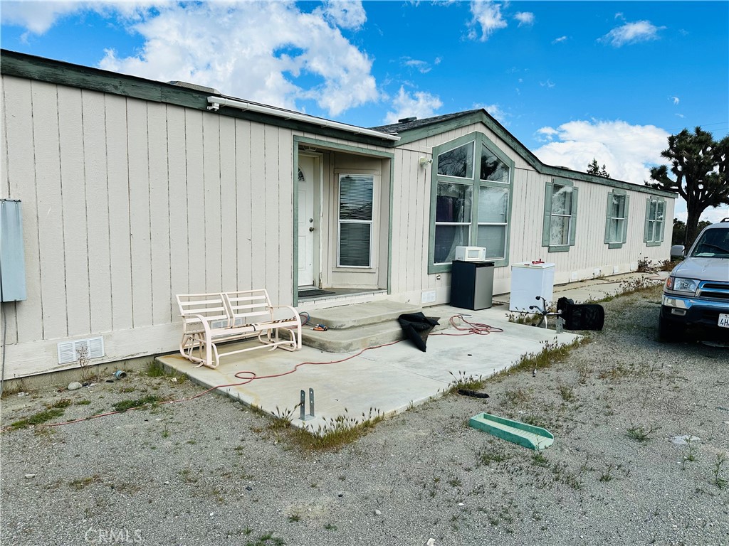 11820 Lebec Road Phelan, CA 92371 - Photo 1 of 1 a view of a house with backyard