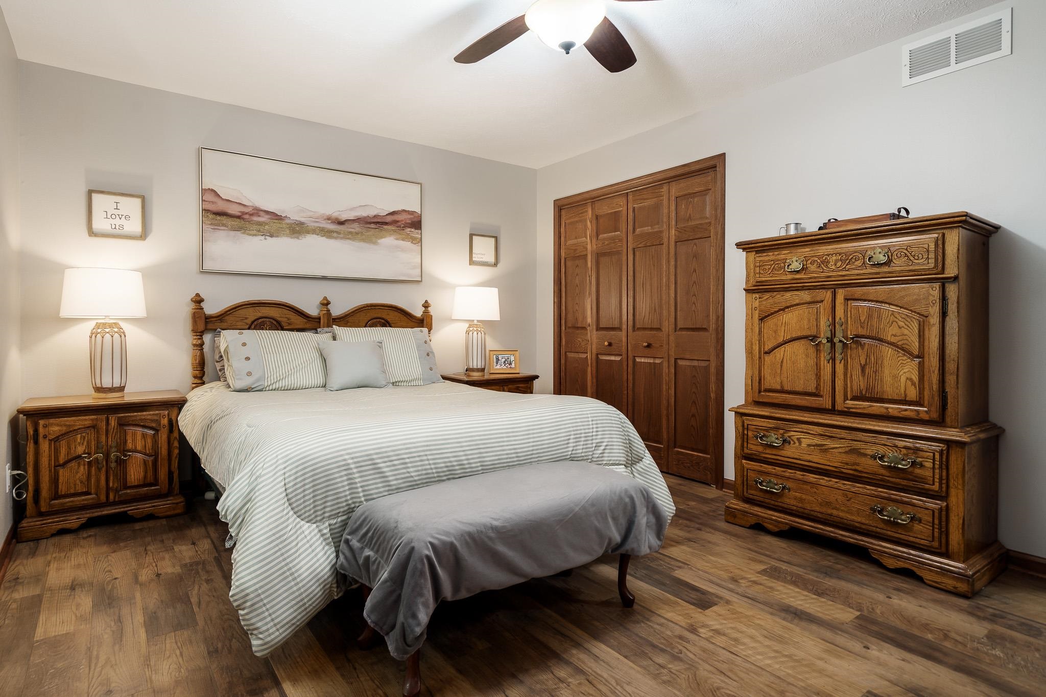 5671 Rural Edge Drive Roscoe, IL 61073 - Photo 20 of 51 a bedroom with a bed and wooden floor