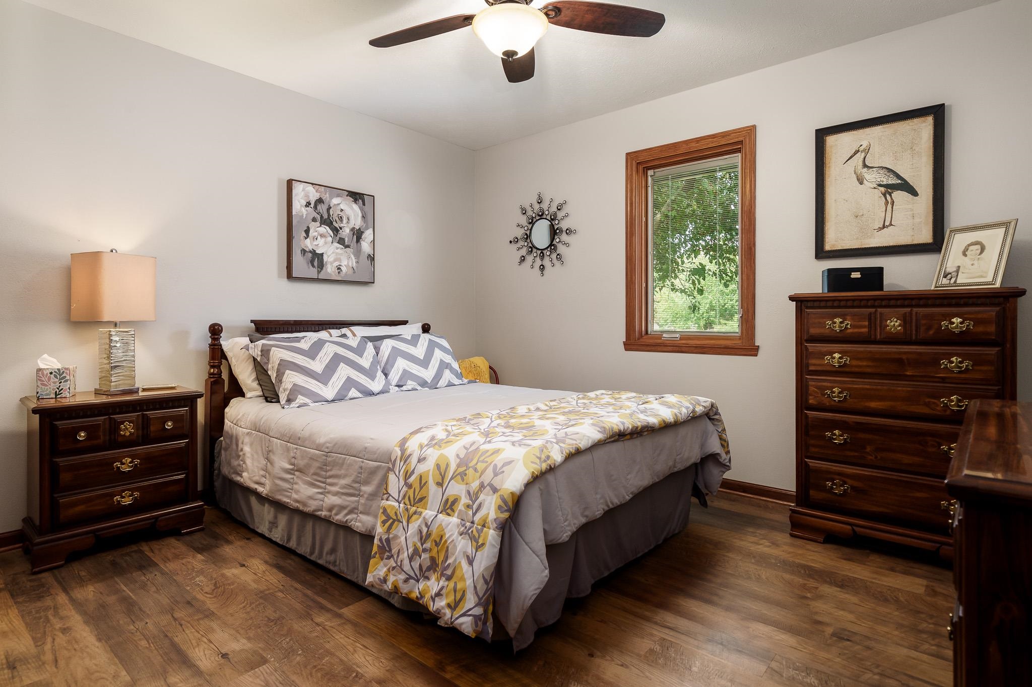 5671 Rural Edge Drive Roscoe, IL 61073 - Photo 24 of 51 a bedroom with a bed and a dresser