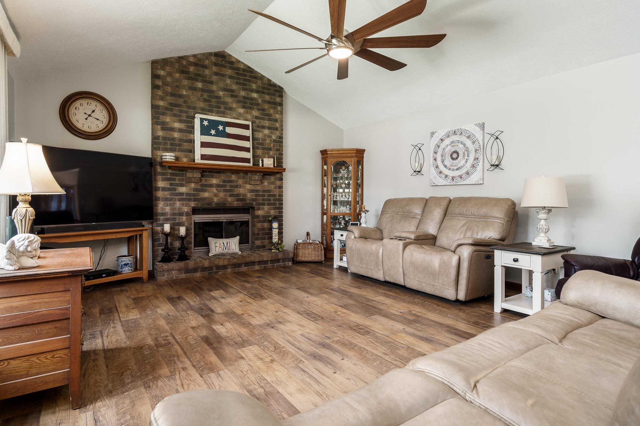5671 Rural Edge Drive Roscoe, IL 61073 - Photo 4 of 51 a living room with furniture and a flat screen tv