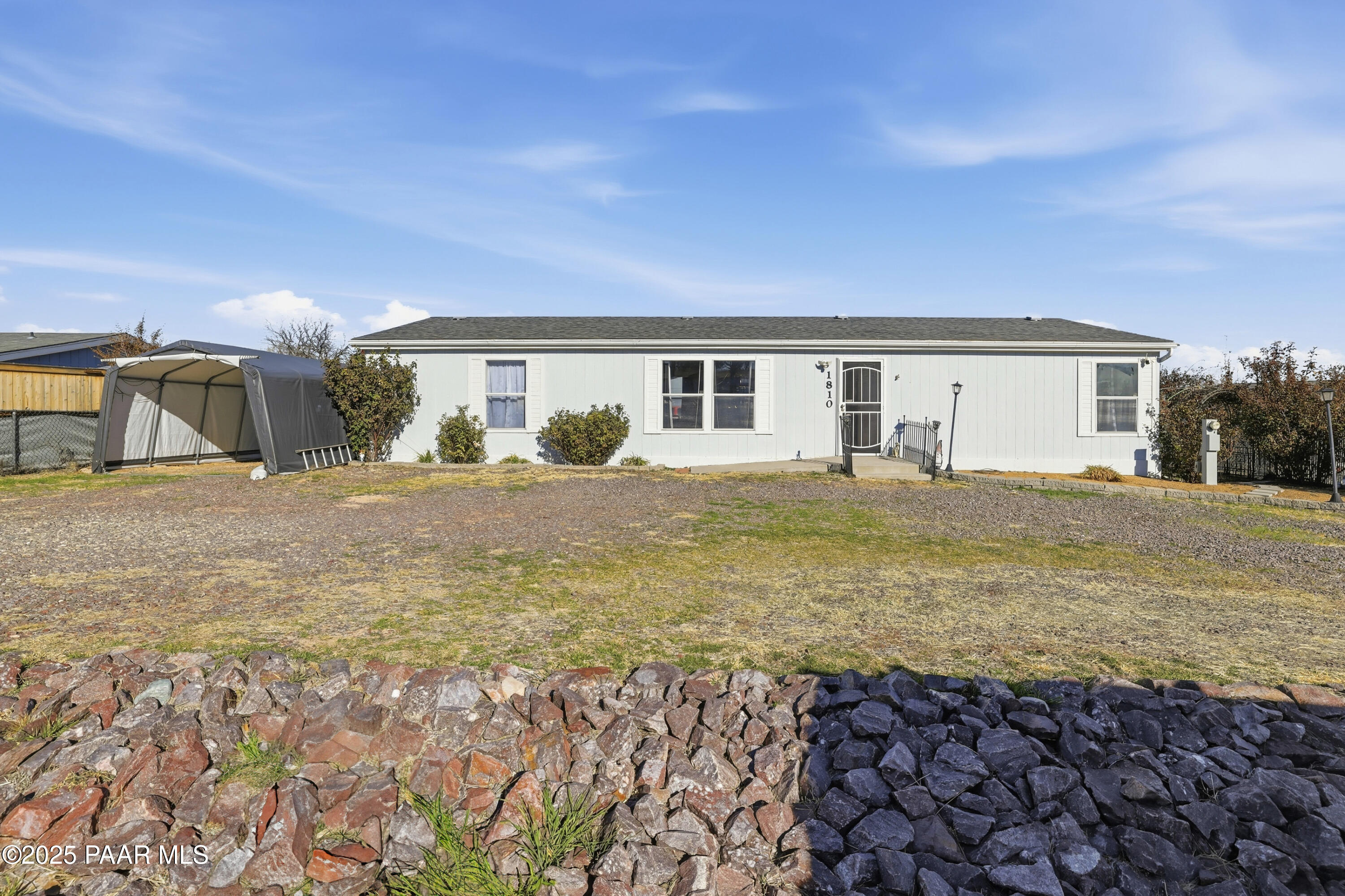 1810 Rhonda Road Chino Valley, AZ 86323 - Photo 1 of 29 a view of a house with backyard and sitting area