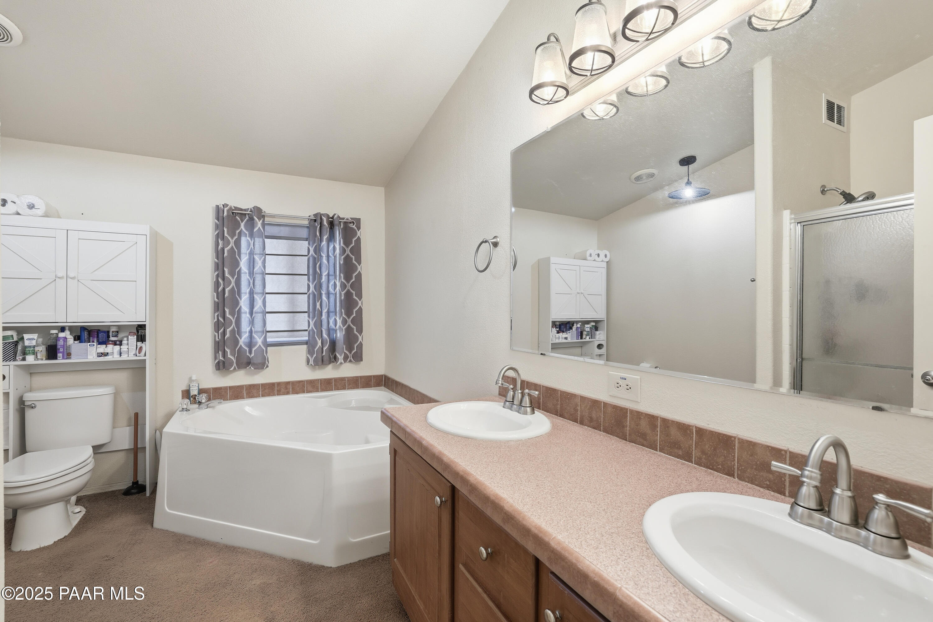 1810 Rhonda Road Chino Valley, AZ 86323 - Photo 14 of 29 a bathroom with a tub sink and mirror