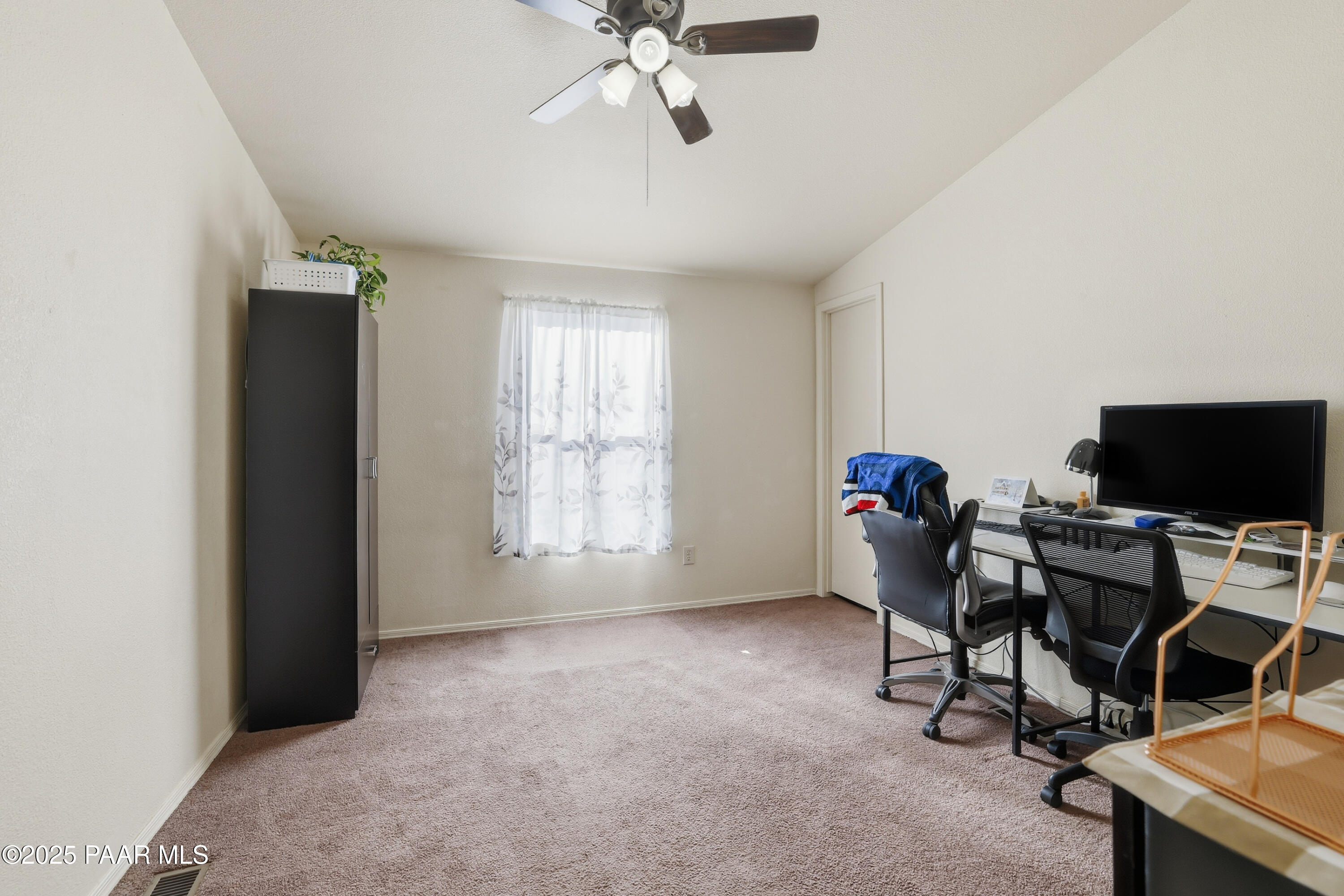 1810 Rhonda Road Chino Valley, AZ 86323 - Photo 17 of 29 a view of a workspace with furniture and a window