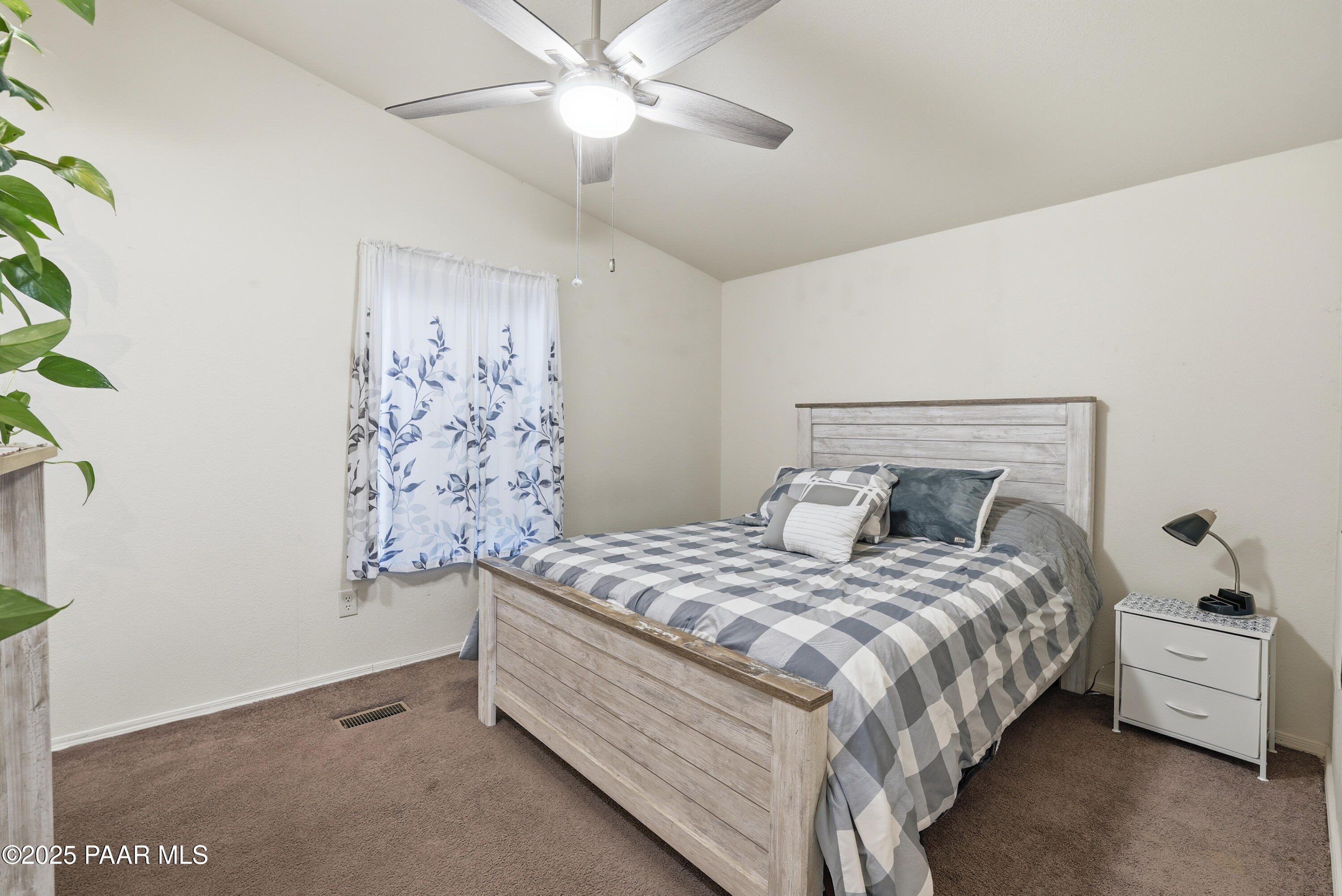 1810 Rhonda Road Chino Valley, AZ 86323 - Photo 18 of 29 a bedroom with a bed and a window