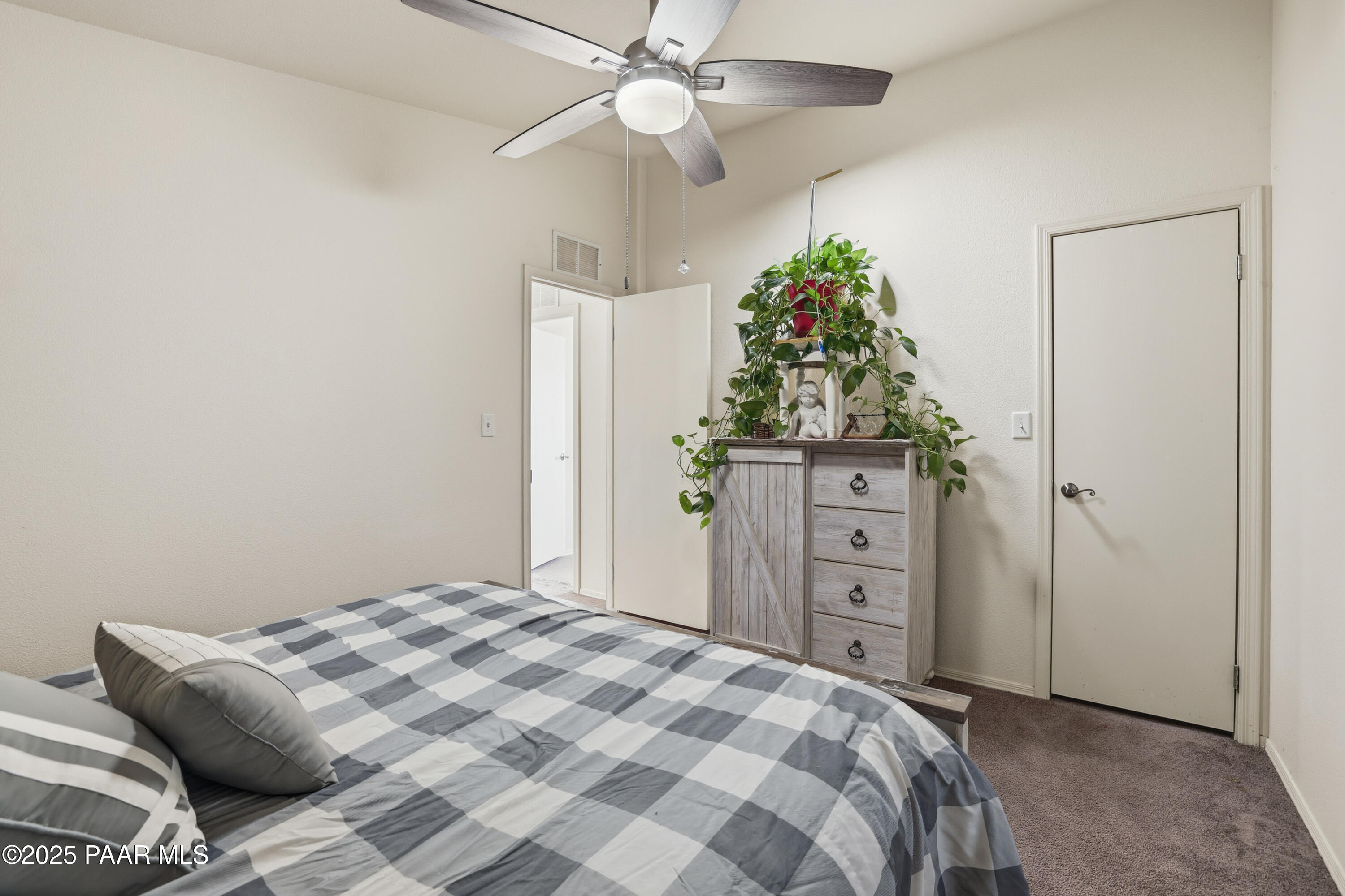 1810 Rhonda Road Chino Valley, AZ 86323 - Photo 19 of 29 a bedroom with a bed and a dresser