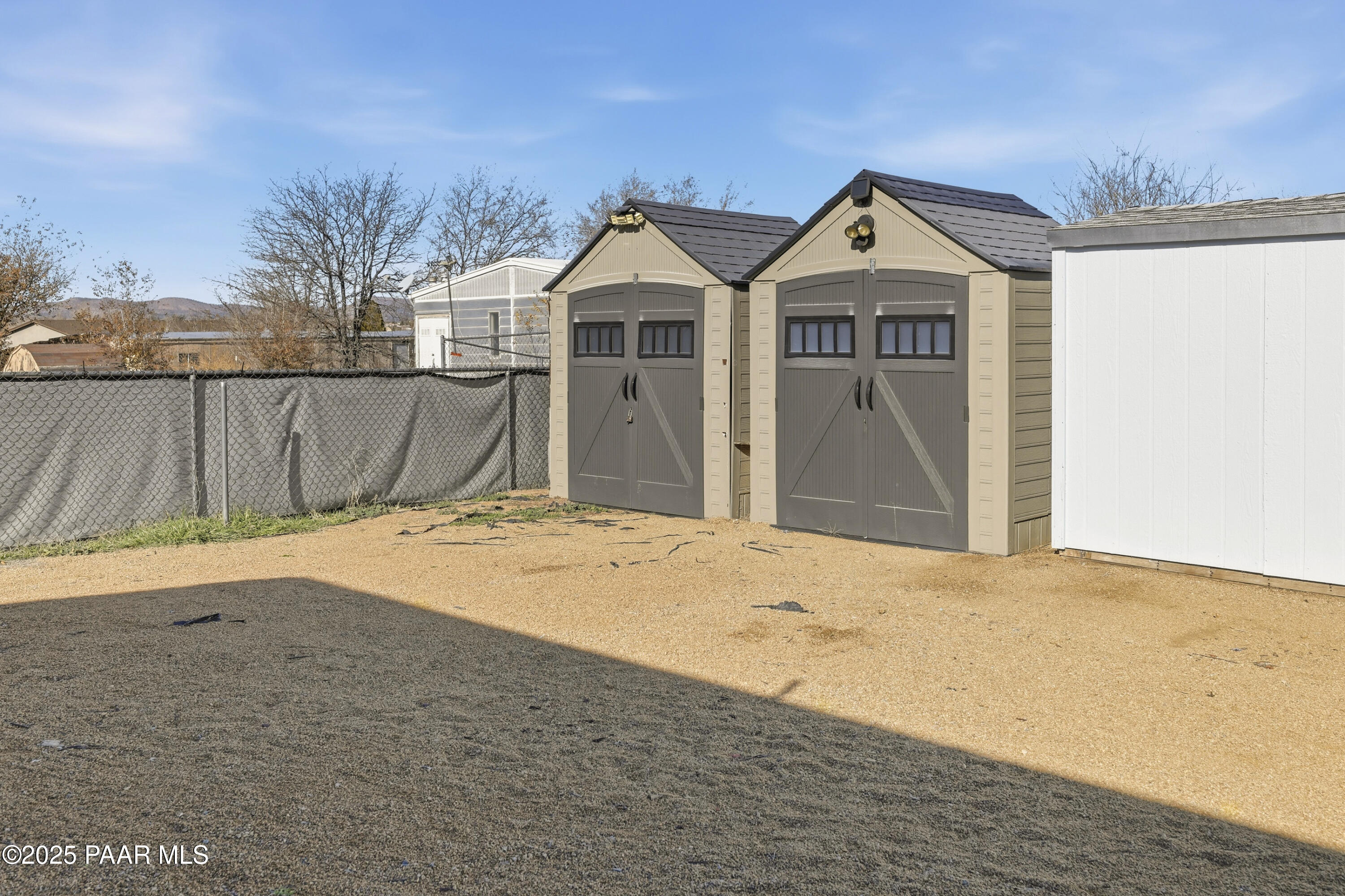 1810 Rhonda Road Chino Valley, AZ 86323 - Photo 23 of 29 a view of a house with a wooden fence