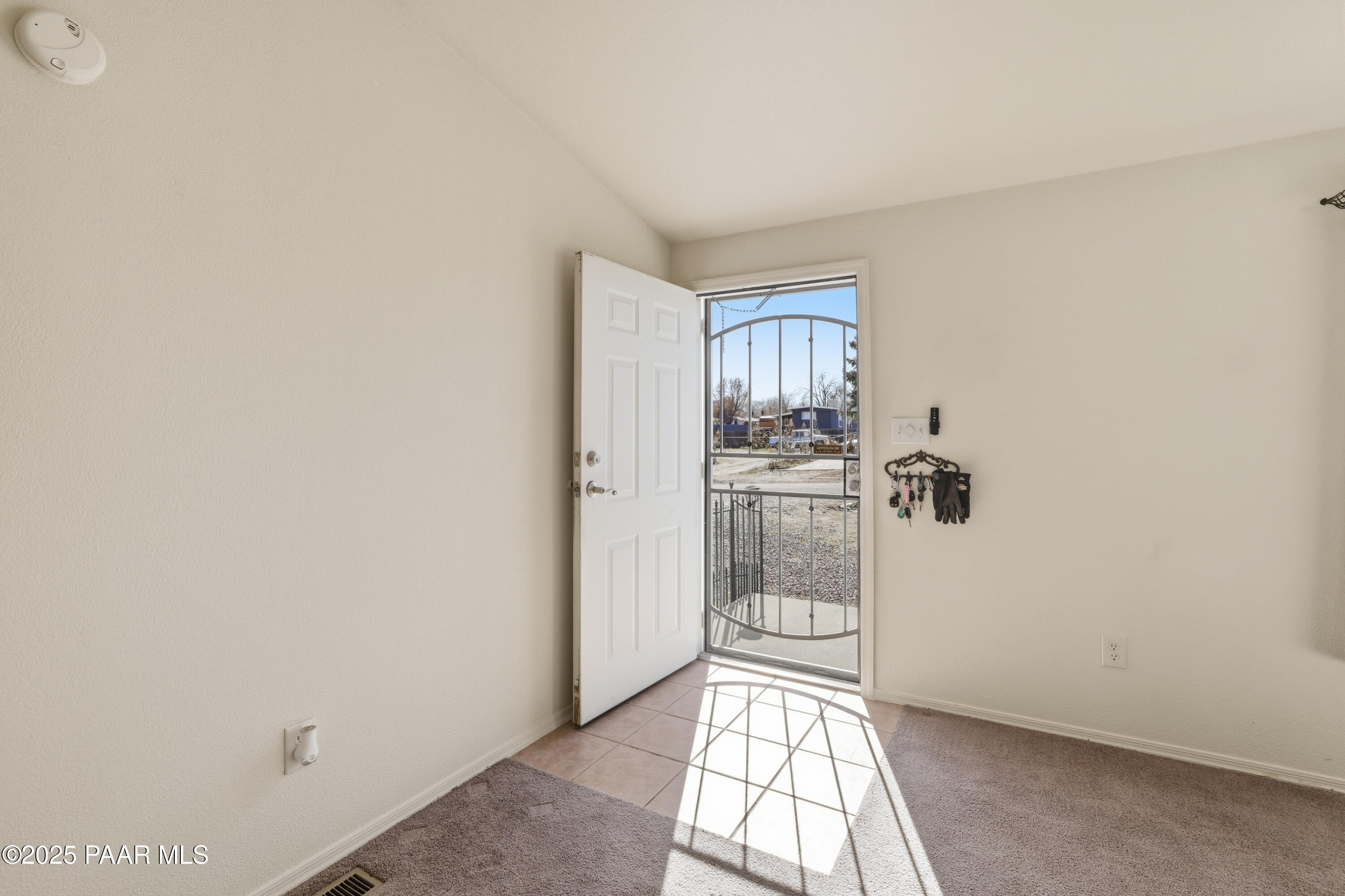 1810 Rhonda Road Chino Valley, AZ 86323 - Photo 3 of 29 a view of empty room with wooden floor