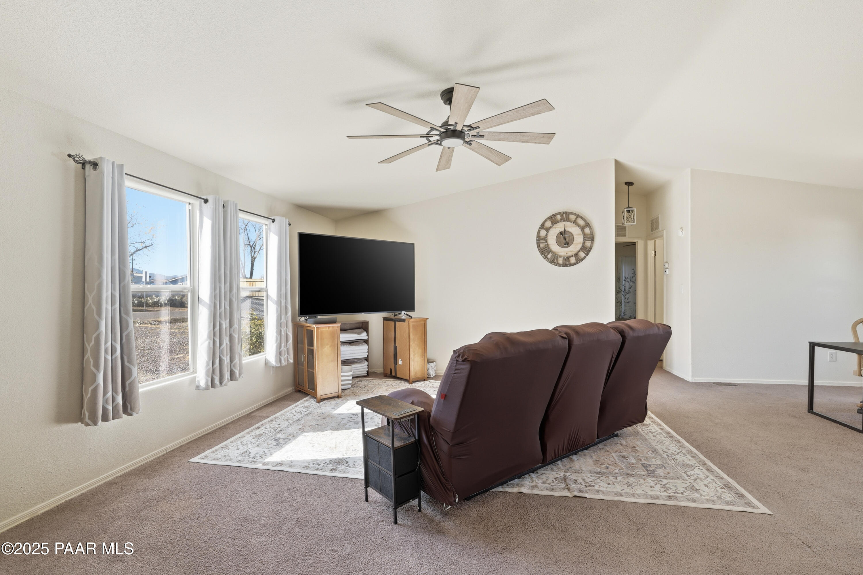 1810 Rhonda Road Chino Valley, AZ 86323 - Photo 5 of 29 a living room with furniture and a flat screen tv