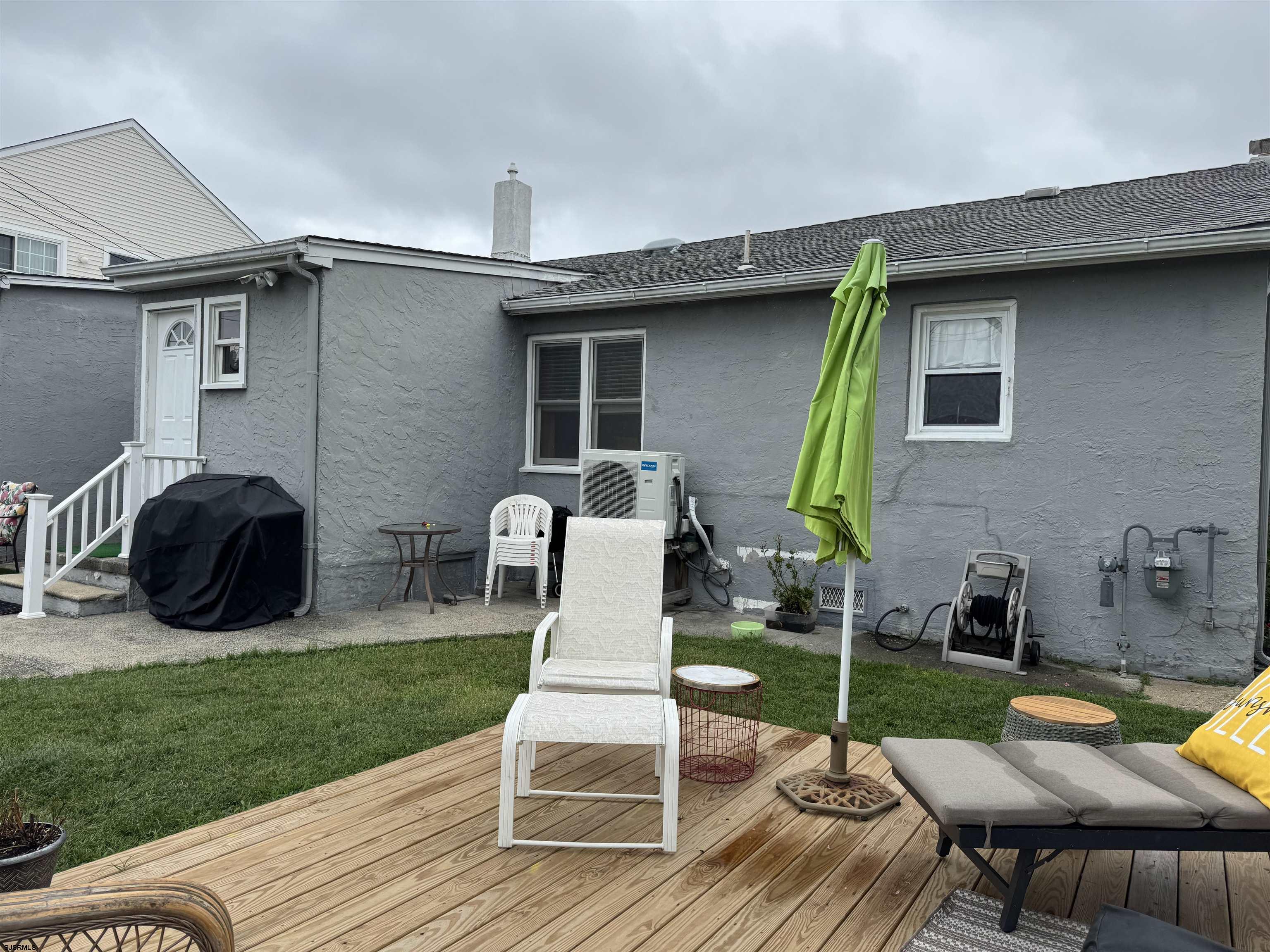 200 27th Street South Brigantine, NJ 08203 - Photo 23 of 33 a patio with table and chairs