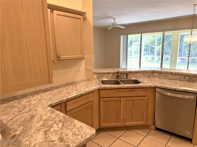 a kitchen with a sink and a window