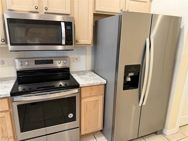 a view of a kitchen with wooden floor and a sink