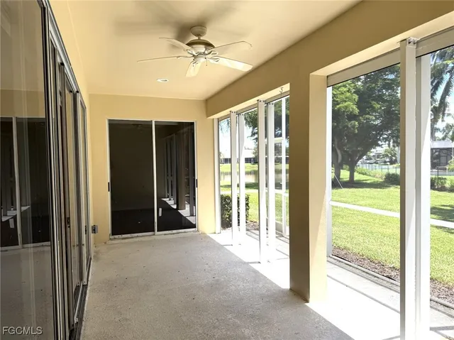 a swimming pool with lots of trees in the background