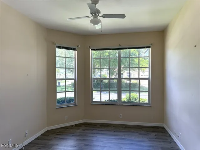 a bathroom with a toilet and a bath tub
