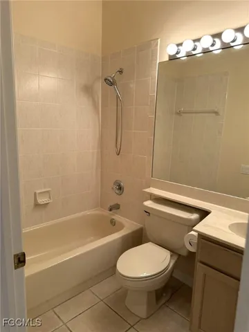 a bathroom with a tub shower and sink