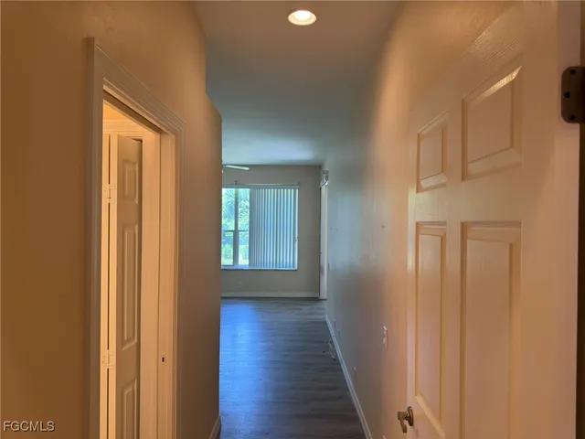 a bathroom with a toilet a sink a mirror a vanity and shower