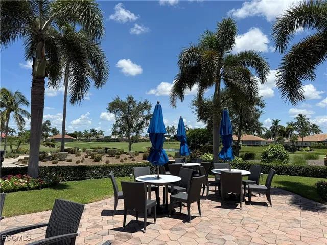 a room with lots of furniture and a large window