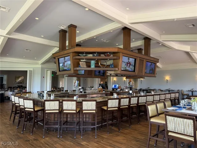 a lobby with furniture and a potted plant