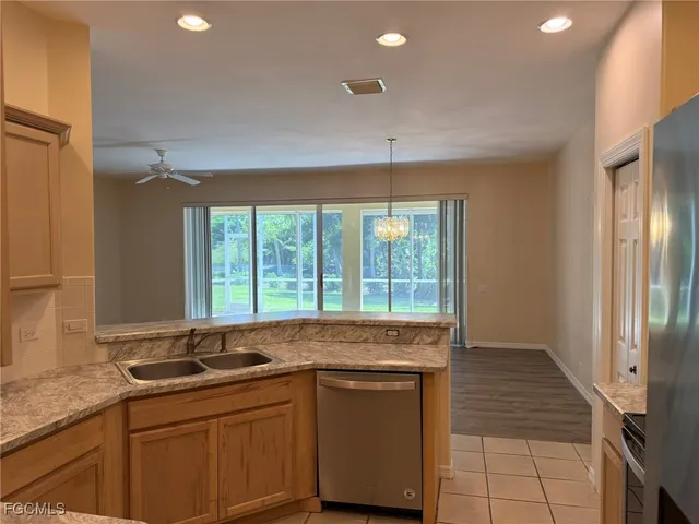 a kitchen with a sink and a window
