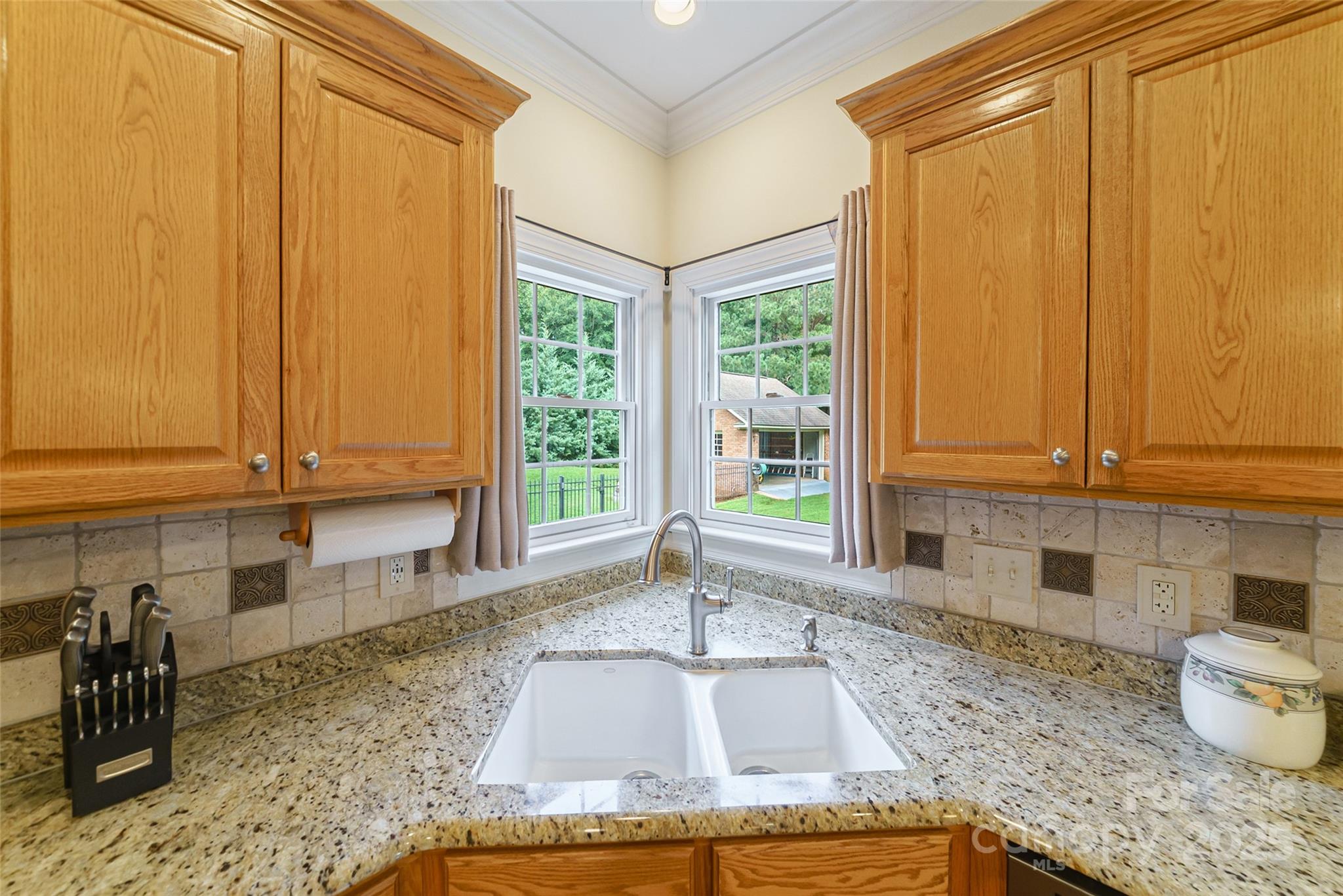 241 Old Springs Road Fort Mill, SC 29715 - Photo 15 of 48 a kitchen with granite countertop a sink a window and cabinets