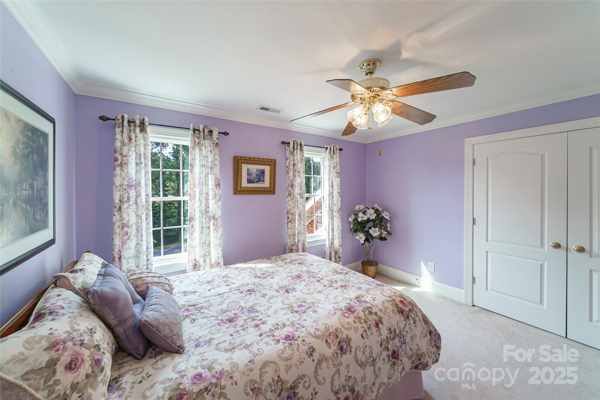 241 Old Springs Road Fort Mill, SC 29715 - Photo 30 of 48 a bedroom with a bed and a chandelier