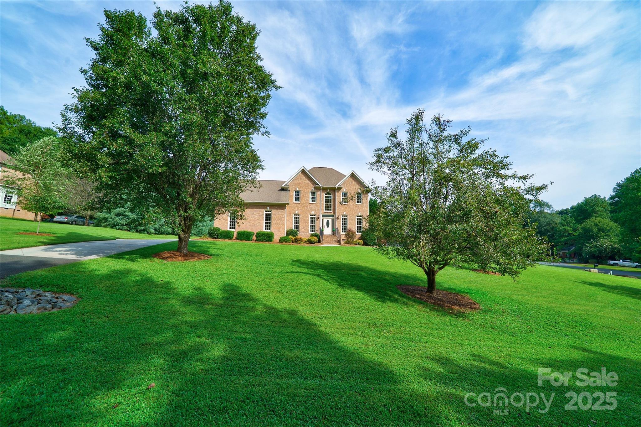 241 Old Springs Road Fort Mill, SC 29715 - Photo 46 of 48 a view of a garden with a house in the background