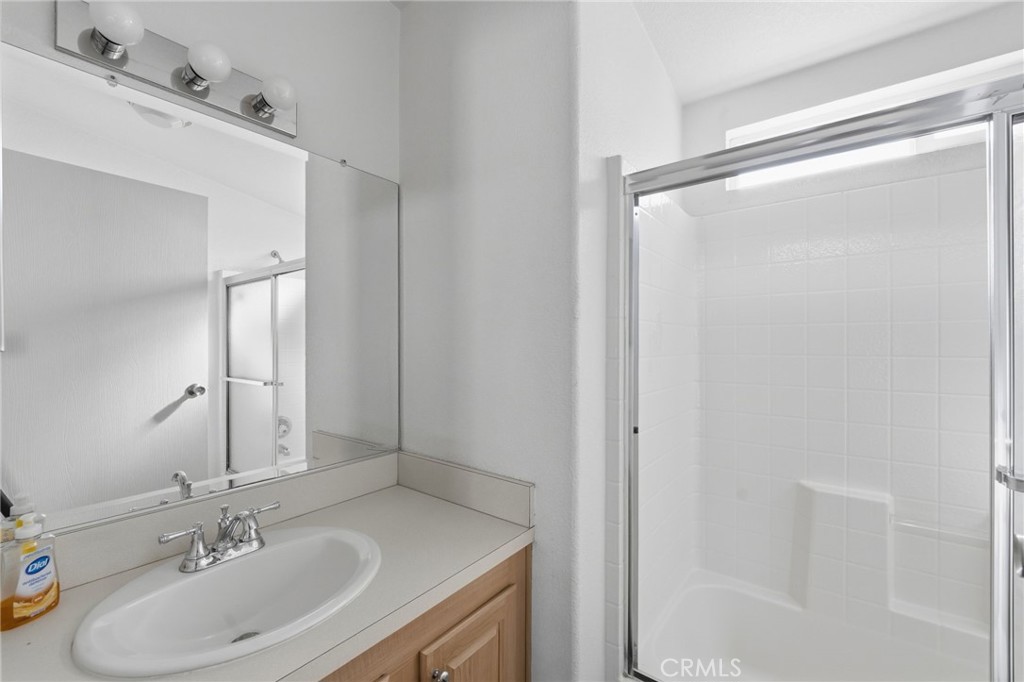 12147 Lakeland Road, Unit 9 Santa Fe Springs, CA 90670 - Photo 16 of 23 a bathroom with a sink and a mirror