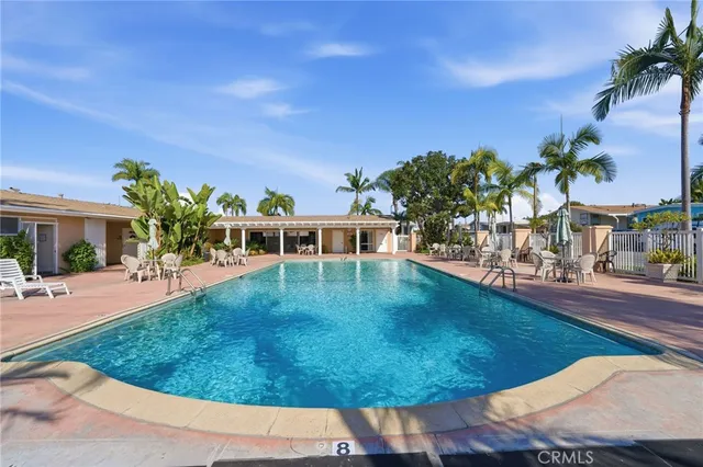 a patio with yard and outdoor seating