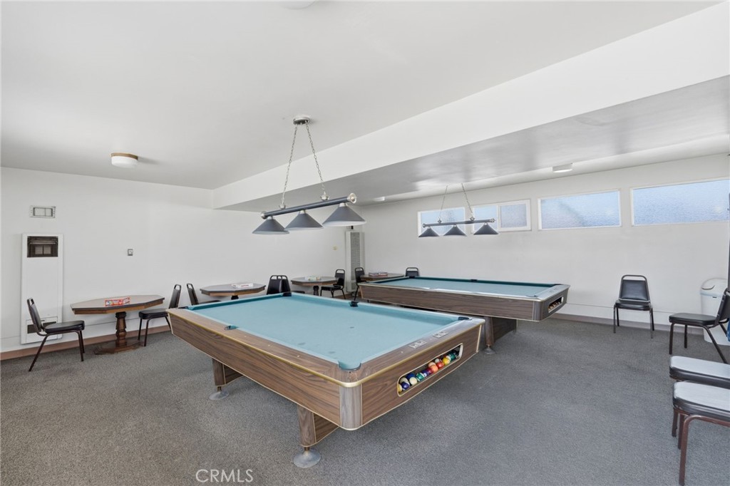 12147 Lakeland Road, Unit 9 Santa Fe Springs, CA 90670 - Photo 20 of 23 a living room with pool table and a projector screen