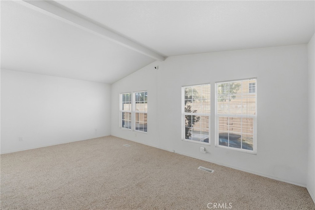 12147 Lakeland Road, Unit 9 Santa Fe Springs, CA 90670 - Photo 2 of 23 an empty room with windows