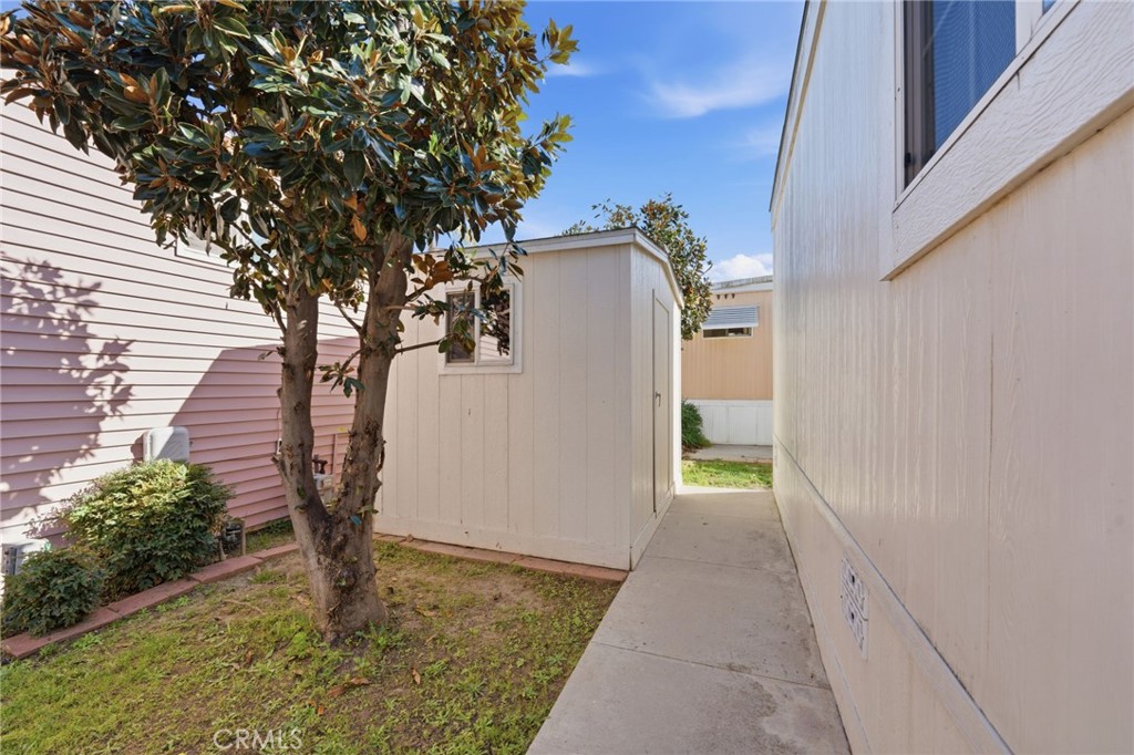 12147 Lakeland Road, Unit 9 Santa Fe Springs, CA 90670 - Photo 22 of 23 a view of a house with a tree