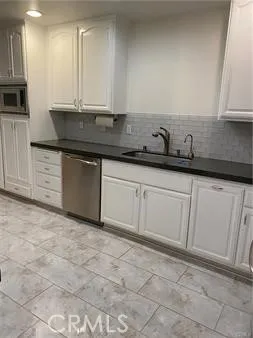 a view of an empty room with a fireplace