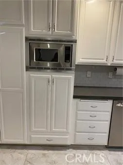 a view of an empty room with windows