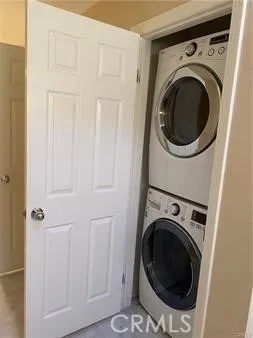 a view of staircase with railing and white walls