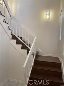 a bathroom with a granite countertop sink and a large mirror