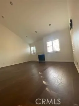 a spacious bathroom with a granite countertop sink a mirror and a bathtub