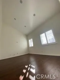 an empty room with wooden floor