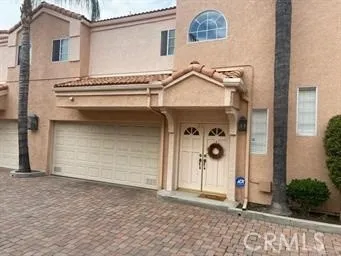a front view of a house with parking area