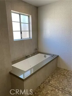 a table with chairs and stove in it