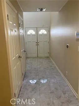 a bathroom with a double sink and a mirror