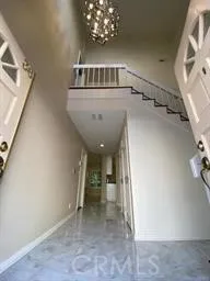 a kitchen with stainless steel appliances granite countertop a refrigerator sink and stove