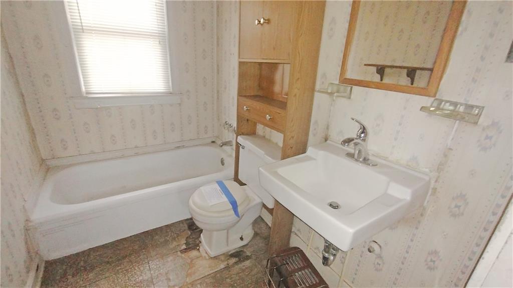 1900 Francis Avenue Northwest Atlanta, GA 30318 - Photo 4 of 9 a bathroom with a sink a toilet and bathtub