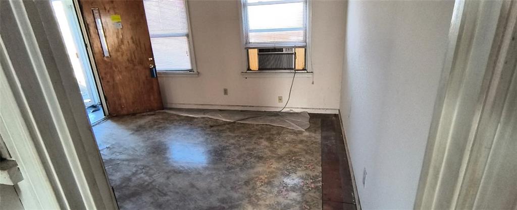 1900 Francis Avenue Northwest Atlanta, GA 30318 - Photo 5 of 9 a view of a hallway with wooden floor and a bathroom