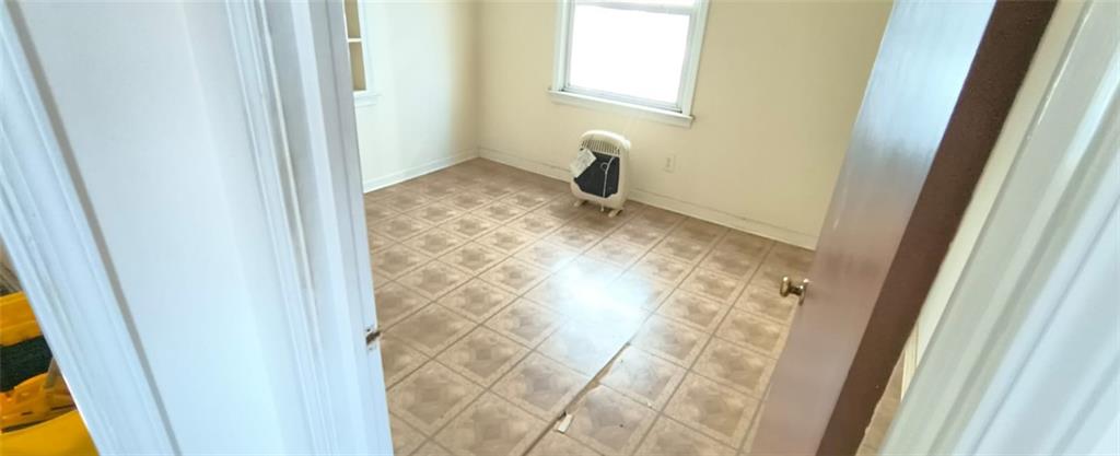 1900 Francis Avenue Northwest Atlanta, GA 30318 - Photo 7 of 9 a bathroom with a granite countertop shower and a sink